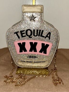 Fozehlad brand novelty purse is shaped like a tequila bottle and BLING